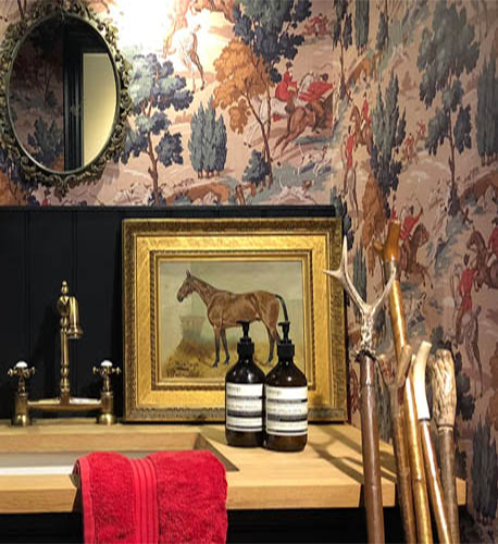 Country house cloakroom, hunting wallpaper