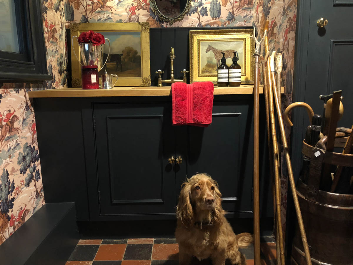 Boot room decor with hunting scene wallpaper by Lewis and Wood